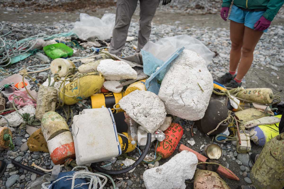 A typical assortment of marine debris, including buoys, styrofoam, shoes and plastic bottles.